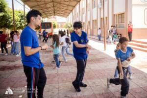 Volunteers and children playing water balloon games in Egypt