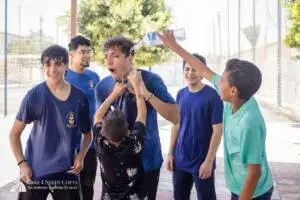 Volunteers and children playing water balloon games in Egypt